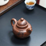 Zisha teapot by artist Level 3, YANG Fei 杨菲（L3-2021）文革紫泥 紫砂壶 “寿珍掇球”