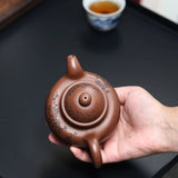 Zisha teapot by artist Level 3, YANG Fei 杨菲（L3-2021）文革紫泥 紫砂壶 “寿珍掇球”